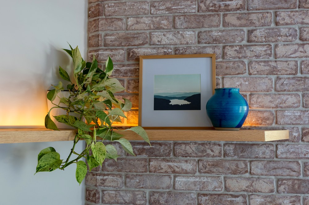 Floating oak shelf with hidden LED accent lighting