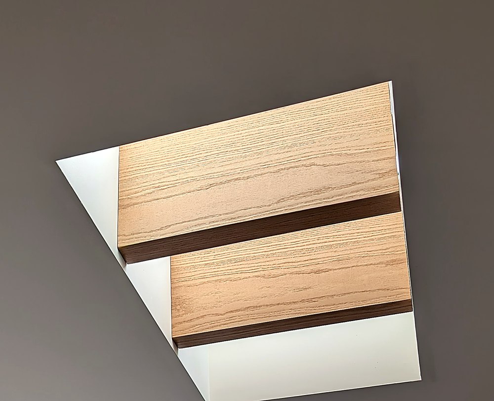 Detail of the oak and walnut beam grain around one skylight